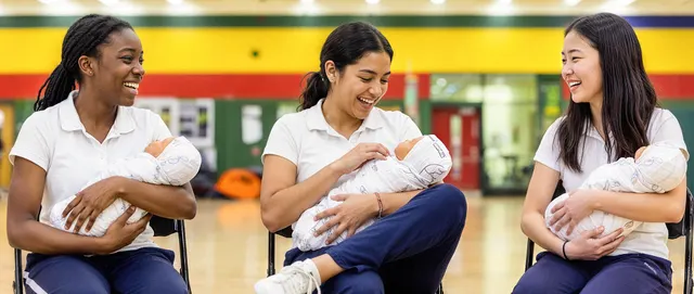 Babysitting skills practice with training dolls